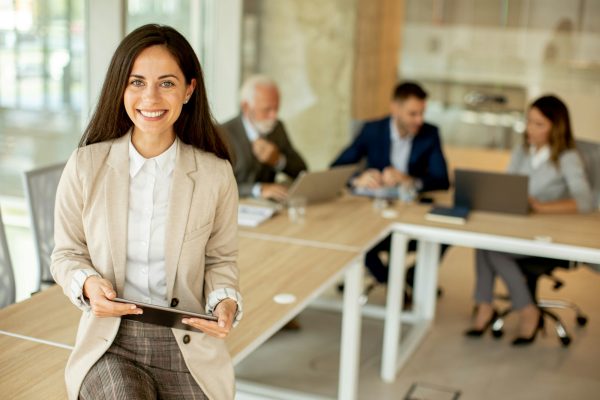 Young woman with digital tablet in the office